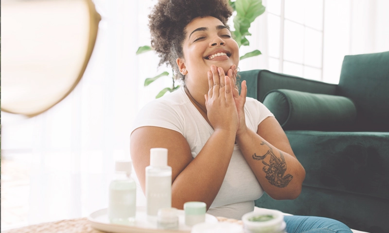 Beautiful woman, skin care products at home