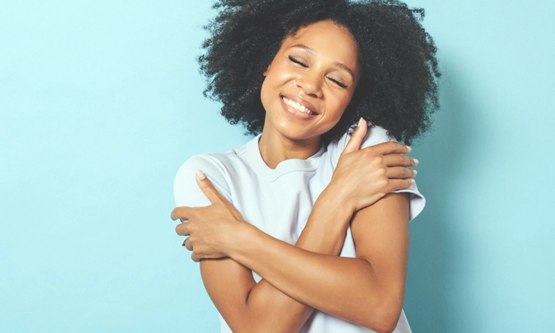 beautiful happy woman embracing self-care