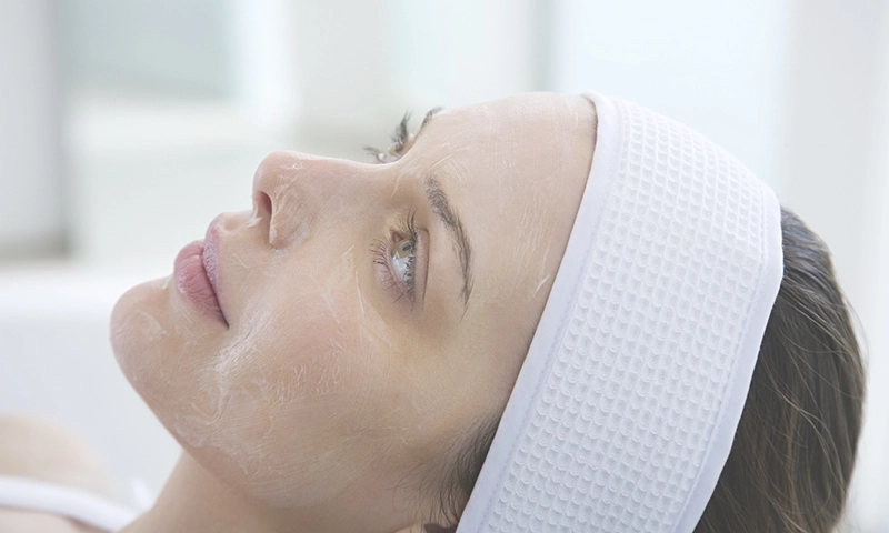 woman with a chemical peel on her face