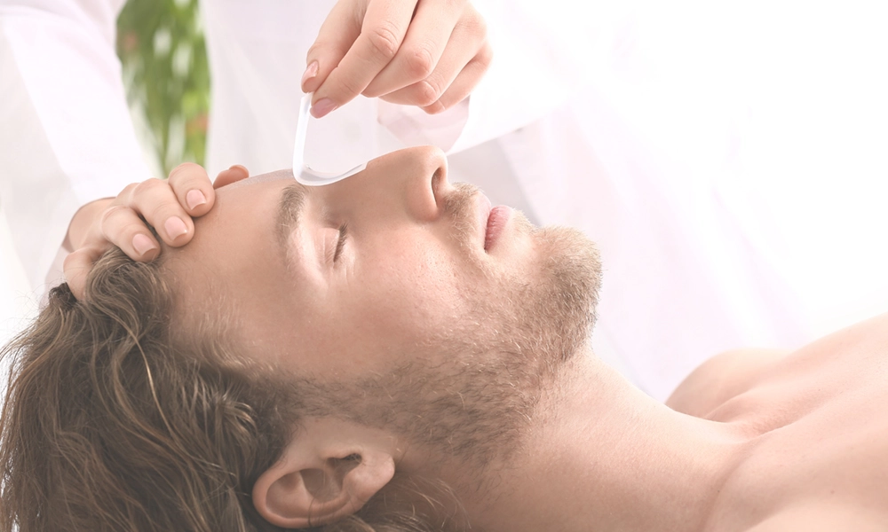 man getting his brows waxed