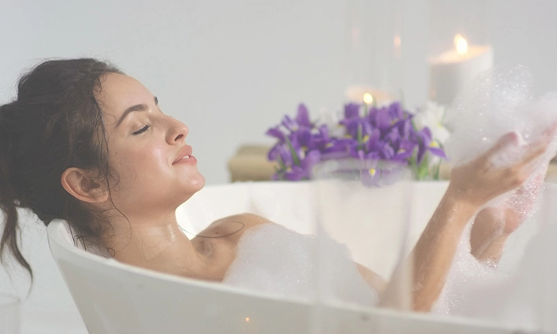 woman soaking in a bubble bath