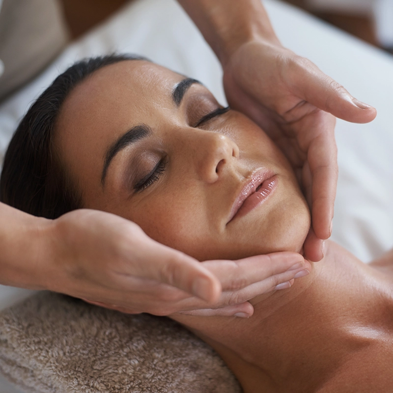 attractive woman enjoying a face massage